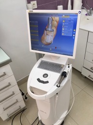 A CEREC dental unit showing teeth on the monitor