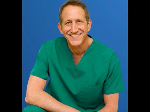 Dentist Dr Lorin Berland wearing a green scrub top, looking at the camera Dentist Dr Lorin Berland wearing a green scrub top, looking at the camera