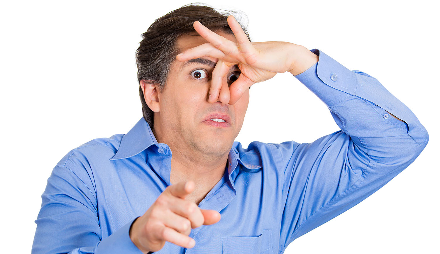 A man in a blue shirt holding his nose and pointing at the camera