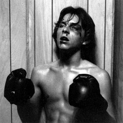 Young boxer with blood on his face